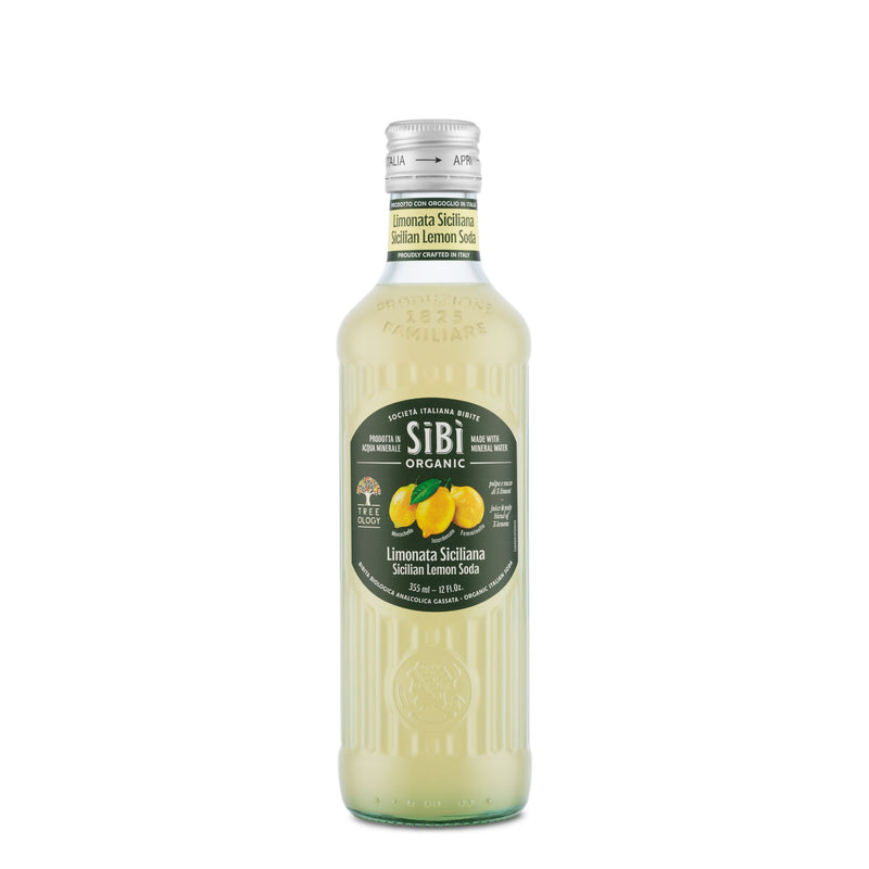 A 355ml Sibilla Organic Sicilian Lemon Soda in a clear glass bottle with a green lemon-themed label and silver cap contains a pale yellow, refreshing Sicilian lemon beverage.