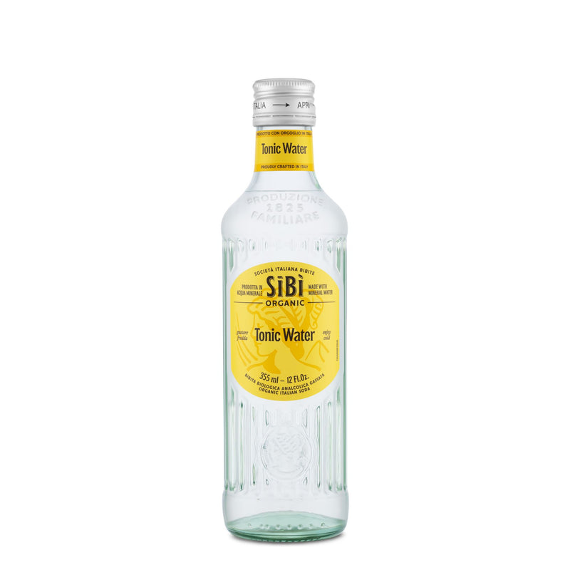 A 355ml Sibilla Organic Italian Tonic Water in a clear glass bottle with a yellow label and silver cap stands upright on a white background, showcasing its premium botanicals—perfect as a mixer.