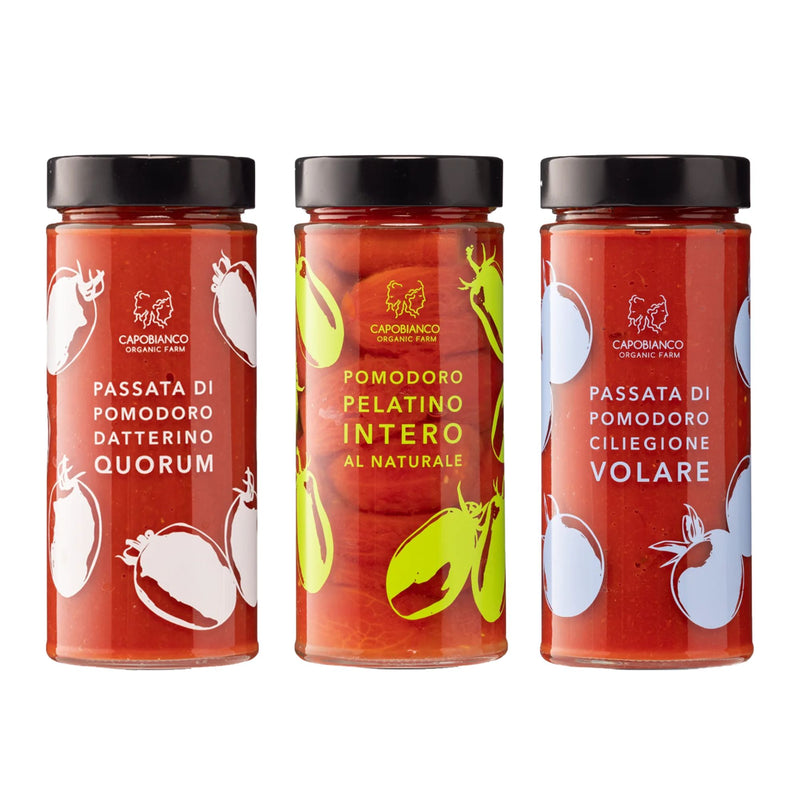 Three Capobianco Vulcano Gift Box jars—each with a black lid and colorful tomato art—feature Italian labels and three organic tomato varieties: Quorum, Intero, and Volare.