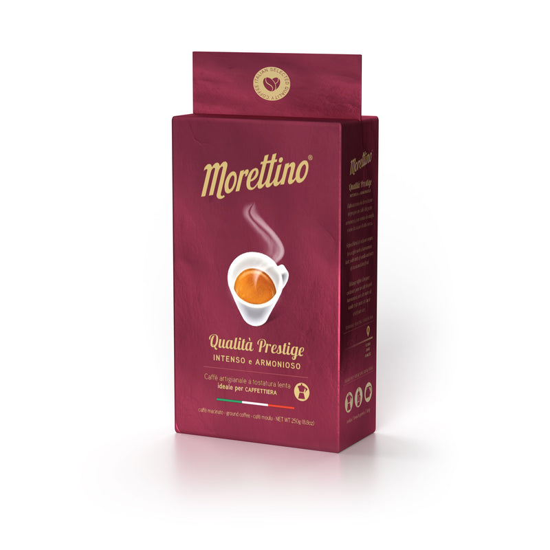 Morettino Quality Prestige Italian Ground Coffee (250g) comes in a red bag featuring a steaming espresso cup, described as intenso e armonioso. This Sicilian coffee is ideal for espresso lovers and perfect for cafetieres.
