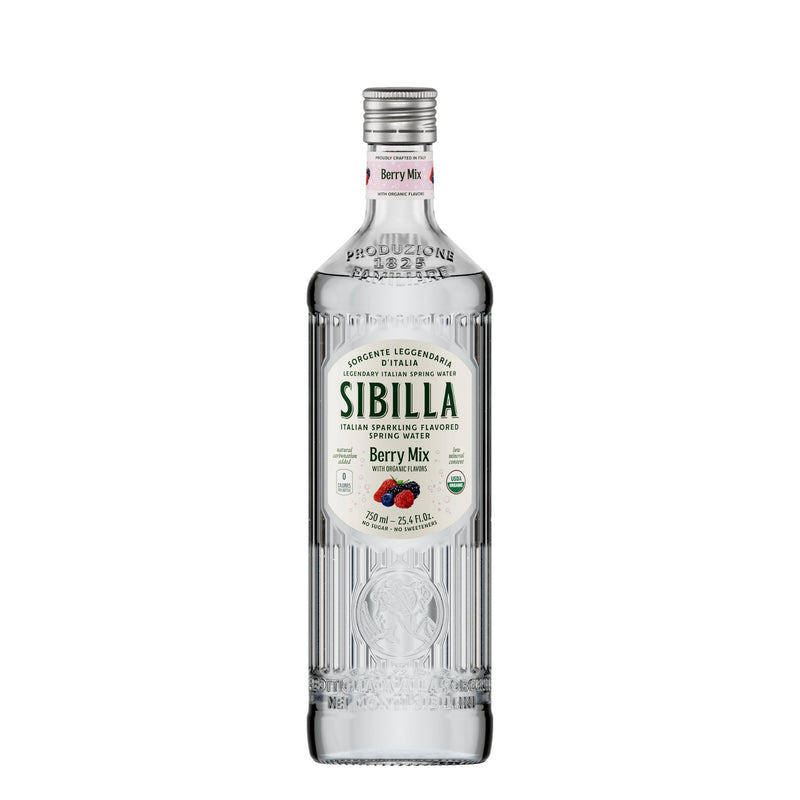 Sibilla Italian Organic Berry Mix Flavored Water comes in a 750ml clear ribbed glass bottle with a silver cap and white label featuring berries and green accents, offering a refreshing, organic taste.