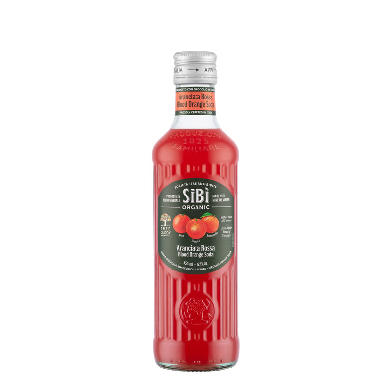 A clear glass bottle of Sibilla Organic Blood Orange Soda (355ml) with a vibrant red drink, green label showing blood oranges and details, and sealed with a silver cap.