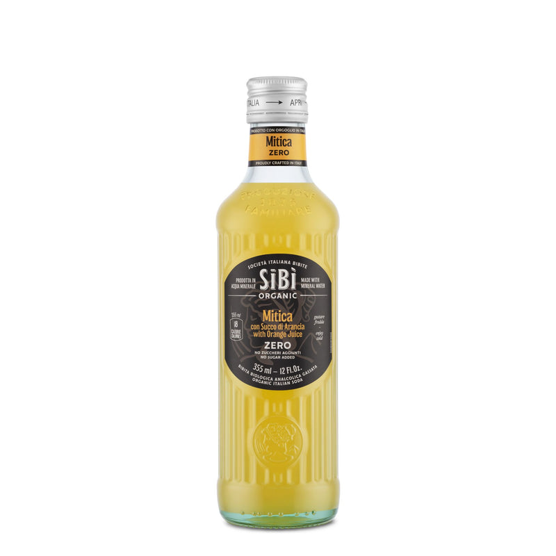 A 355ml glass bottle of Sibilla Organic Italian Mitica Zero (With Orange Juice) features a black label with white and gold text, showcasing Sicilian orange flavor, and is displayed against a white background.