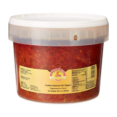Tutto Calabria Crushed Hot Chili Peppers, Restaurant Size (98.7 oz), come in a plastic tub with a clear lid and yellow label displaying product info, nutrition facts, and the Tutto Calabria brand logo for authentic Italian spice.